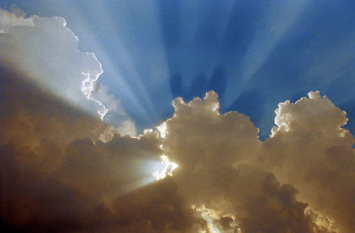 sunrays pouring out of clouds